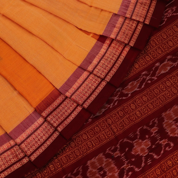 Full view of a yellow cotton Bomkai saree with maroon border and intricate butta pattern