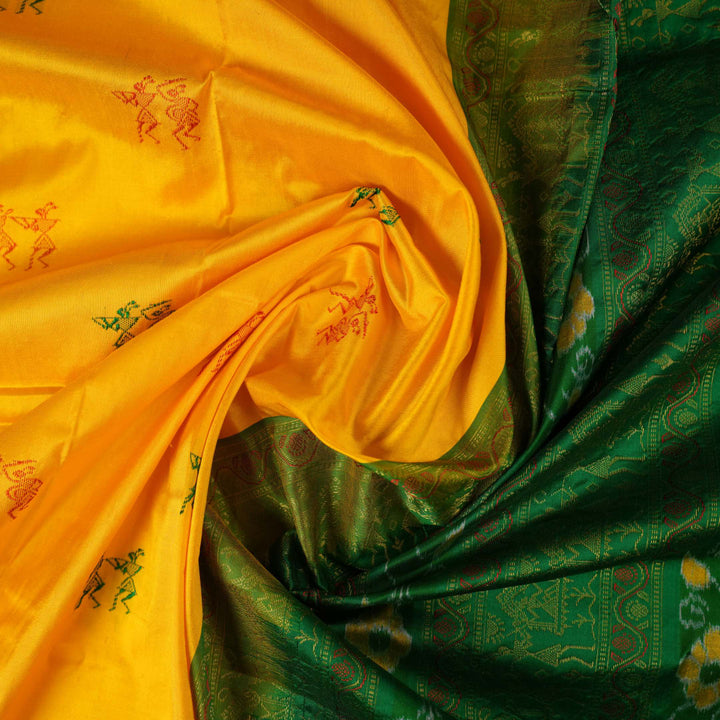 Extreme close-up of yellow Bomkai Silk Saree fabric, revealing the rich silk texture and weave.