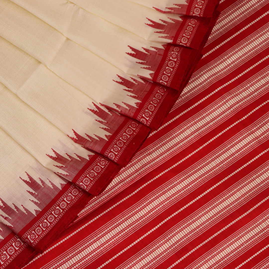 Close-up of plain white silk fabric with intricate Berhampuri weaving in red