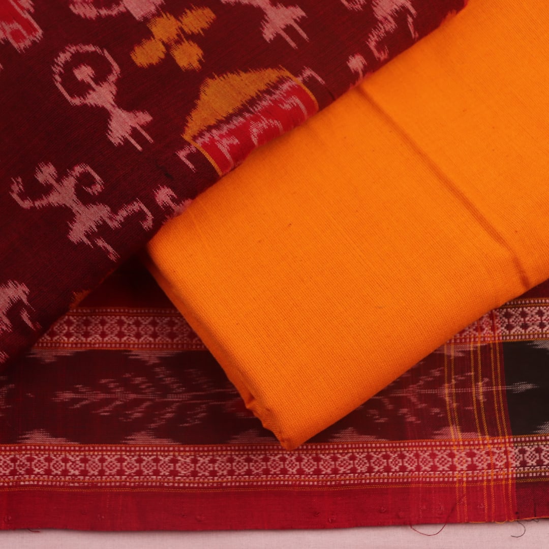 Detail of Sambalpuri cotton dress material blouse piece, maroon and yellow motifs.