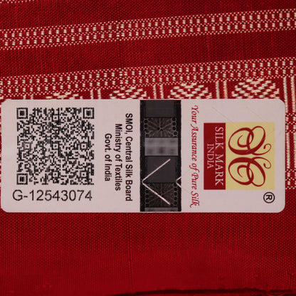Close-up of multicolored silk Sambalpuri saree fabric showing intricate handloom weave texture.