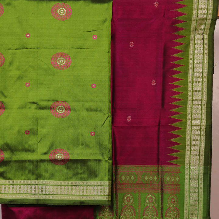 Green Bomkai silk dress material: Detail of magenta blouse piece with butta pattern.