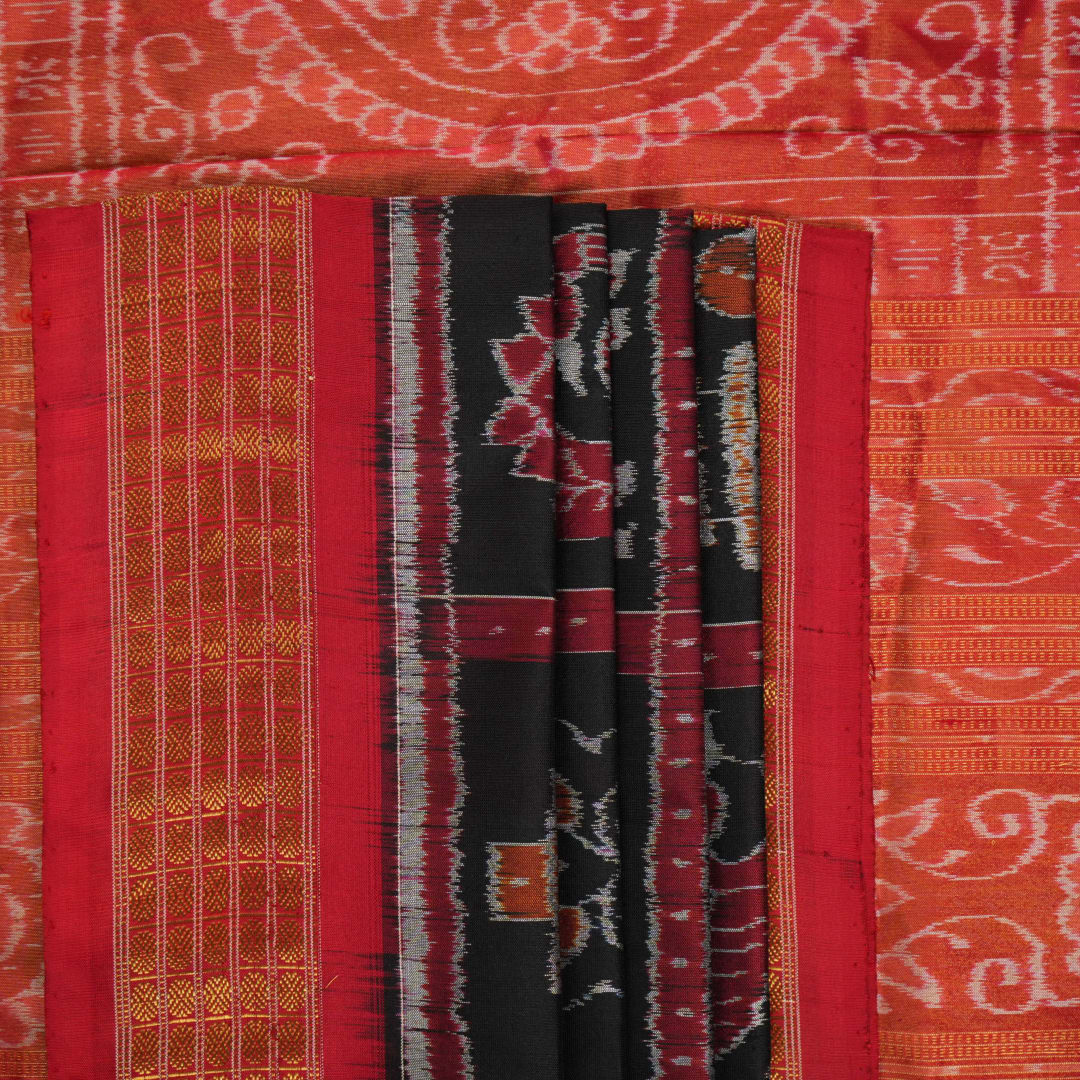 Close-up of Sambalpuri silk saree fabric, revealing rich texture, weave, and subtle tissue motifs.