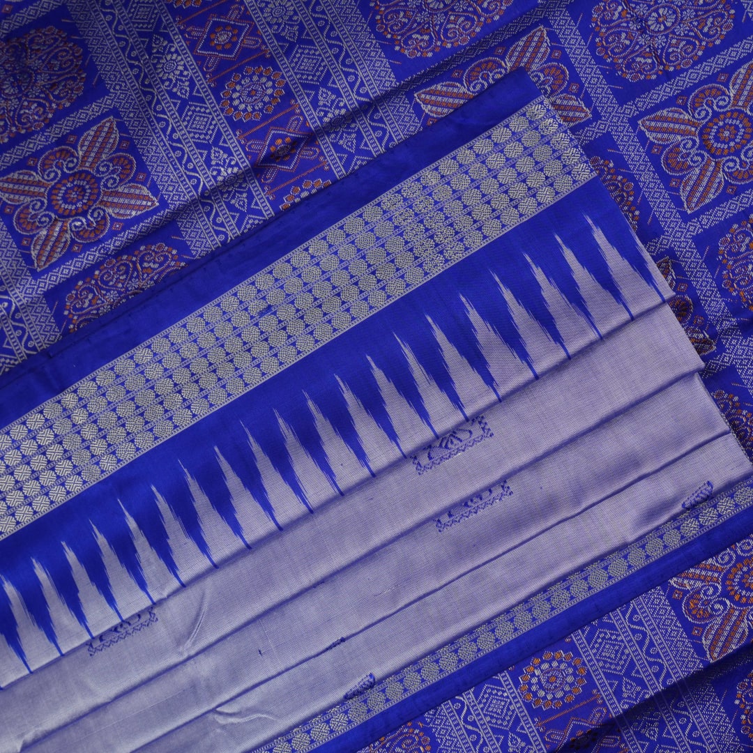 Ultra close-up of Bomkai Silk Saree fabric, highlighting the exquisite grey and blue weave texture.