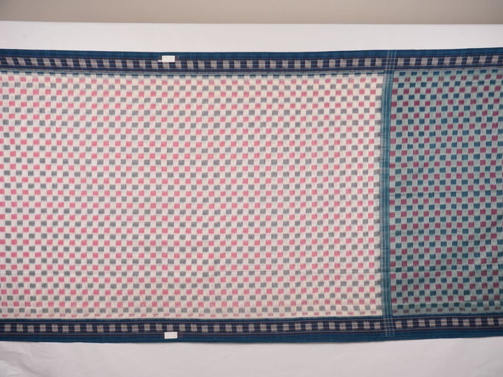 Styling view of a model draped in a white and blue Sambalpuri cotton saree with motif patterns