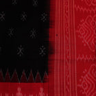 Close-up of a lightweight, black cotton Sambalpuri dupatta with red motifs in the border