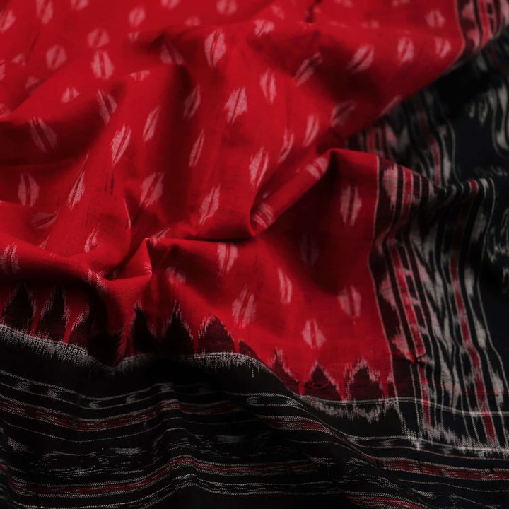 Styling view of a red and black Sambalpuri cotton dupatta with intricate motifs