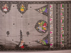 Close-up of grey silk Patachitra saree fabric showing hand-painted texture and intricate weave detail.