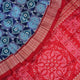 Close-up of the luxurious silk fabric texture and distinctive Sambalpuri ikat weave of the blue Pasapalli saree.