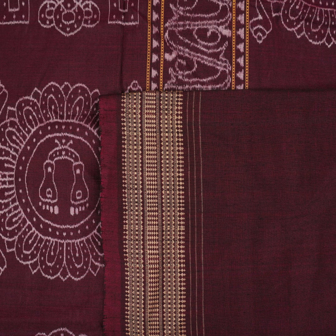 Full flat layout of green and maroon Sambalpuri cotton saree showcasing the complete body and pallu motifs.