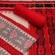 Close-up view of blouse piece with Sambalpuri motifs in grey and red cotton