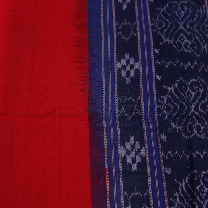 Styling view of a red and blue Sambalpuri cotton dupatta with plain pattern and tassels