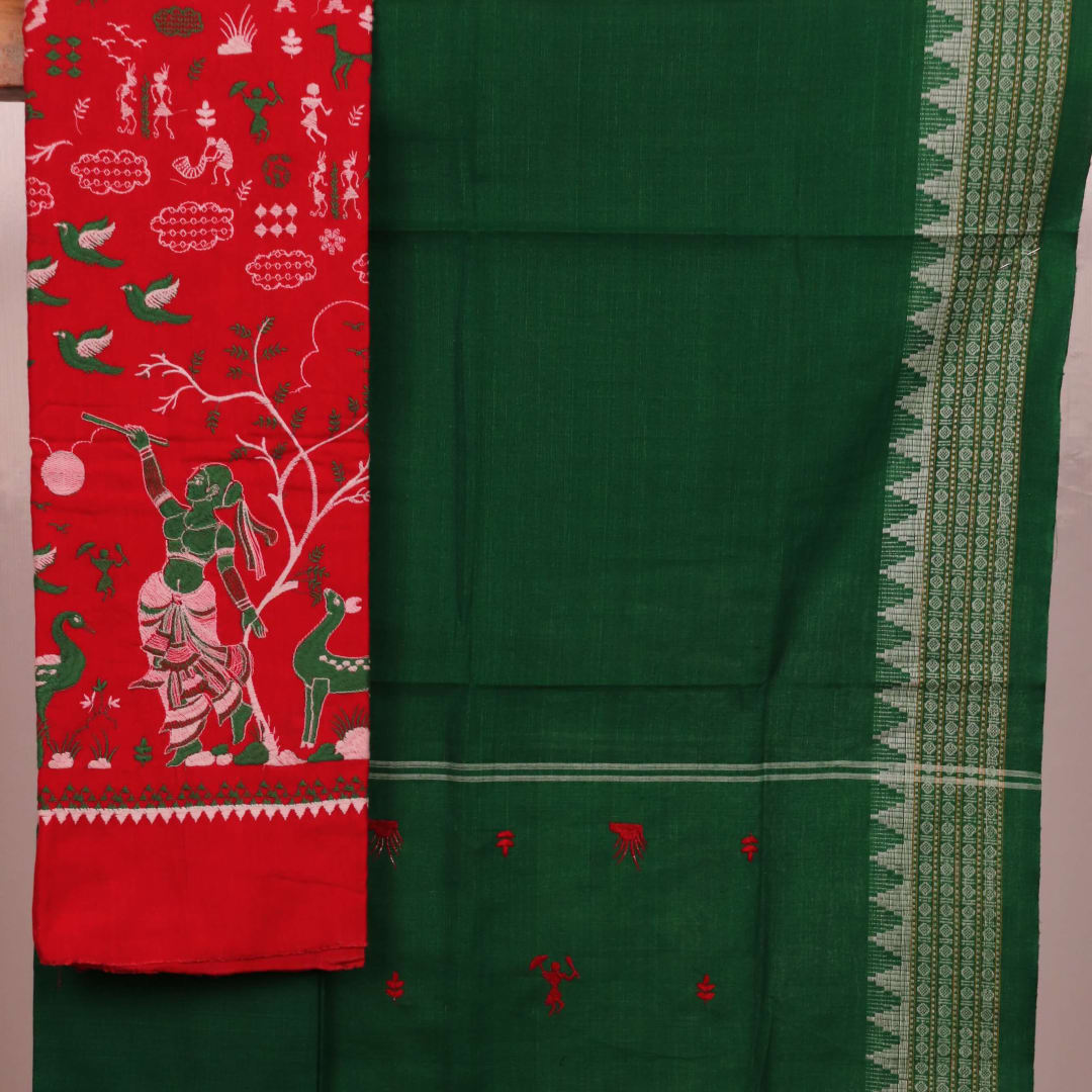 Red and green cotton Sambalpuri dress material with a doll pattern on the body of the fabric.