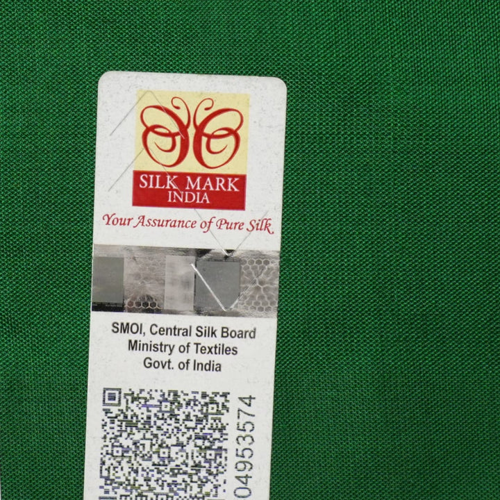 Extreme close-up of yellow Bomkai Silk Saree fabric, revealing the rich silk texture and weave.