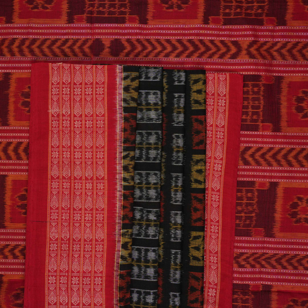Full layout of the black and red Sambalpuri cotton saree displaying the complete pattern and border design.