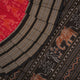 Flat layout view of the red and black Sambalpuri cotton saree showing the body, border, and pallu.