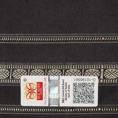 Extreme close-up revealing the fine handloom texture and intricate weave of the Bomkai silk fabric.