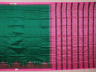 Close-up of plain green and pink Sambalpuri silk saree fabric texture.