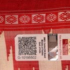 Close-up view of the intricate silk texture on a Berhampuri saree in white with a red border