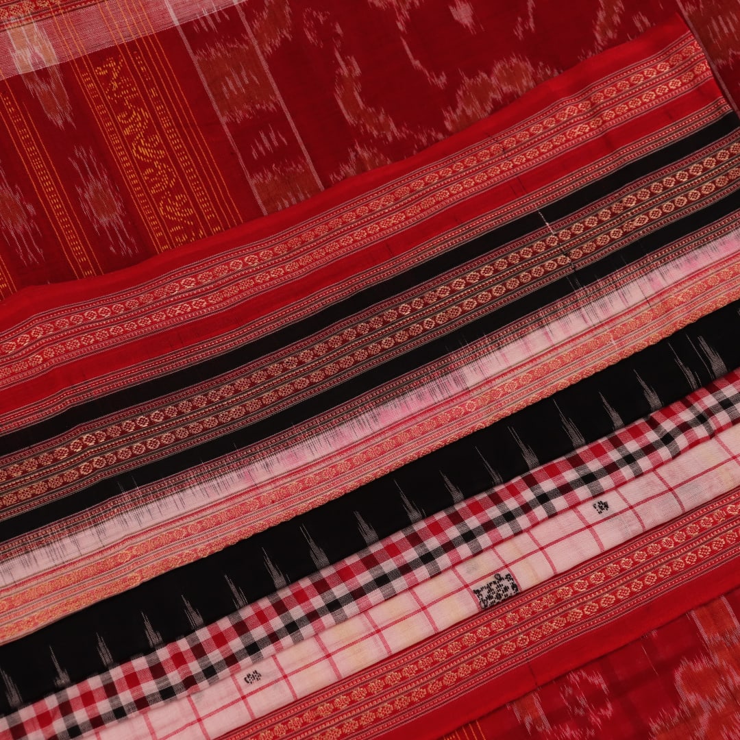 Full view of a multi-colored Bomkai cotton saree featuring a butta pattern with a red border.