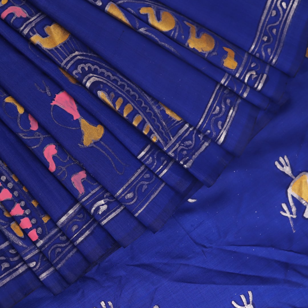 Close-up of handloom blue silk Patachitra saree, showcasing the detailed texture of the hand-painted fabric.
