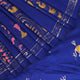 Close-up of handloom blue silk Patachitra saree, showcasing the detailed texture of the hand-painted fabric.