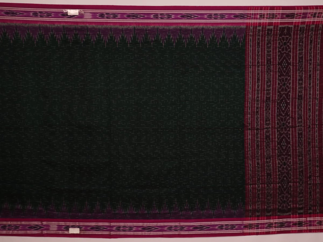 A model drapes an elegant green and magenta Sambalpuri cotton saree with a Pasapalli pattern, showcasing its intricate design and flowing form.