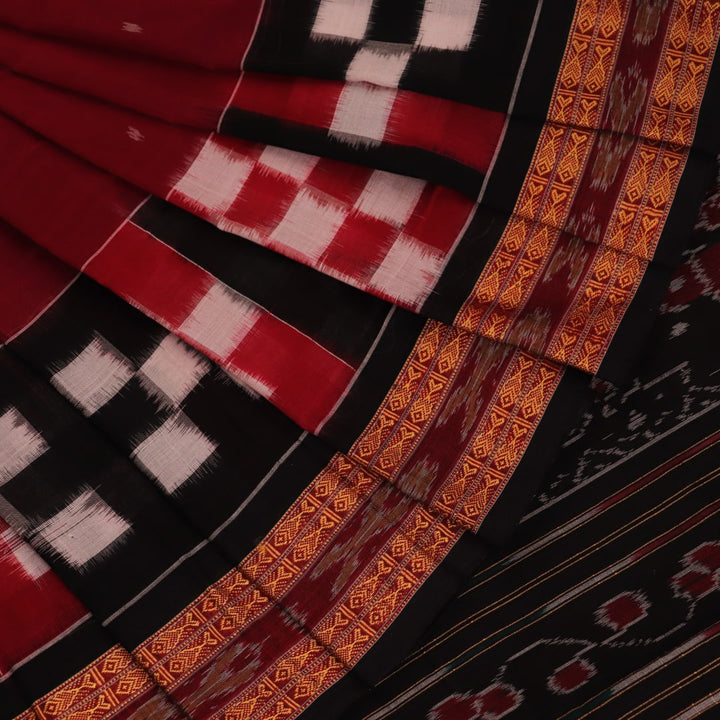 Full view of a maroon Sambalpuri cotton saree with a black Pasapalli pattern.