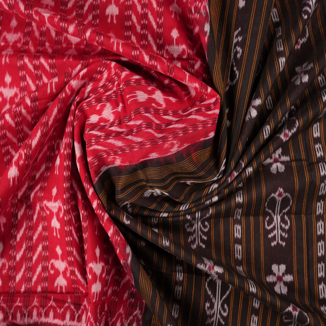 Full layout of a red and black Sambalpuri cotton saree displaying the overall body and pallu design.