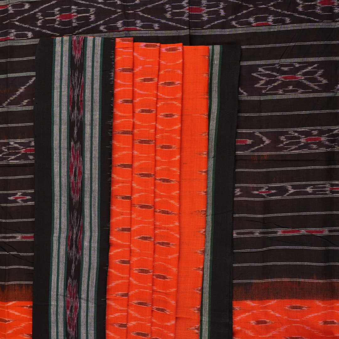 Model wearing an orange and black Sambalpuri cotton saree, styled in an elegant traditional drape.