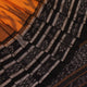 Draped view of a yellow and black Sambalpuri cotton saree with motifs, showcasing its styling and fall.