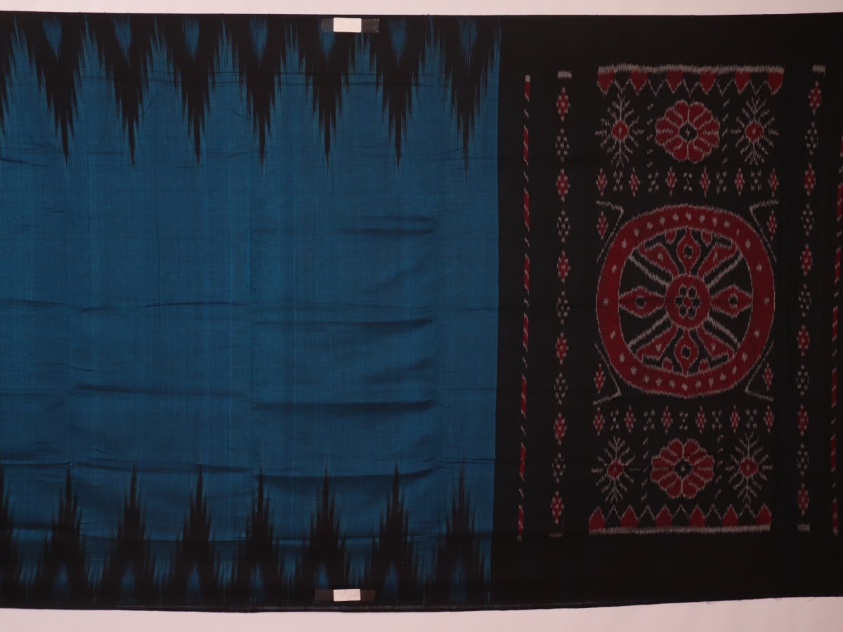 Draped plain blue and black Sambalpuri cotton saree.
