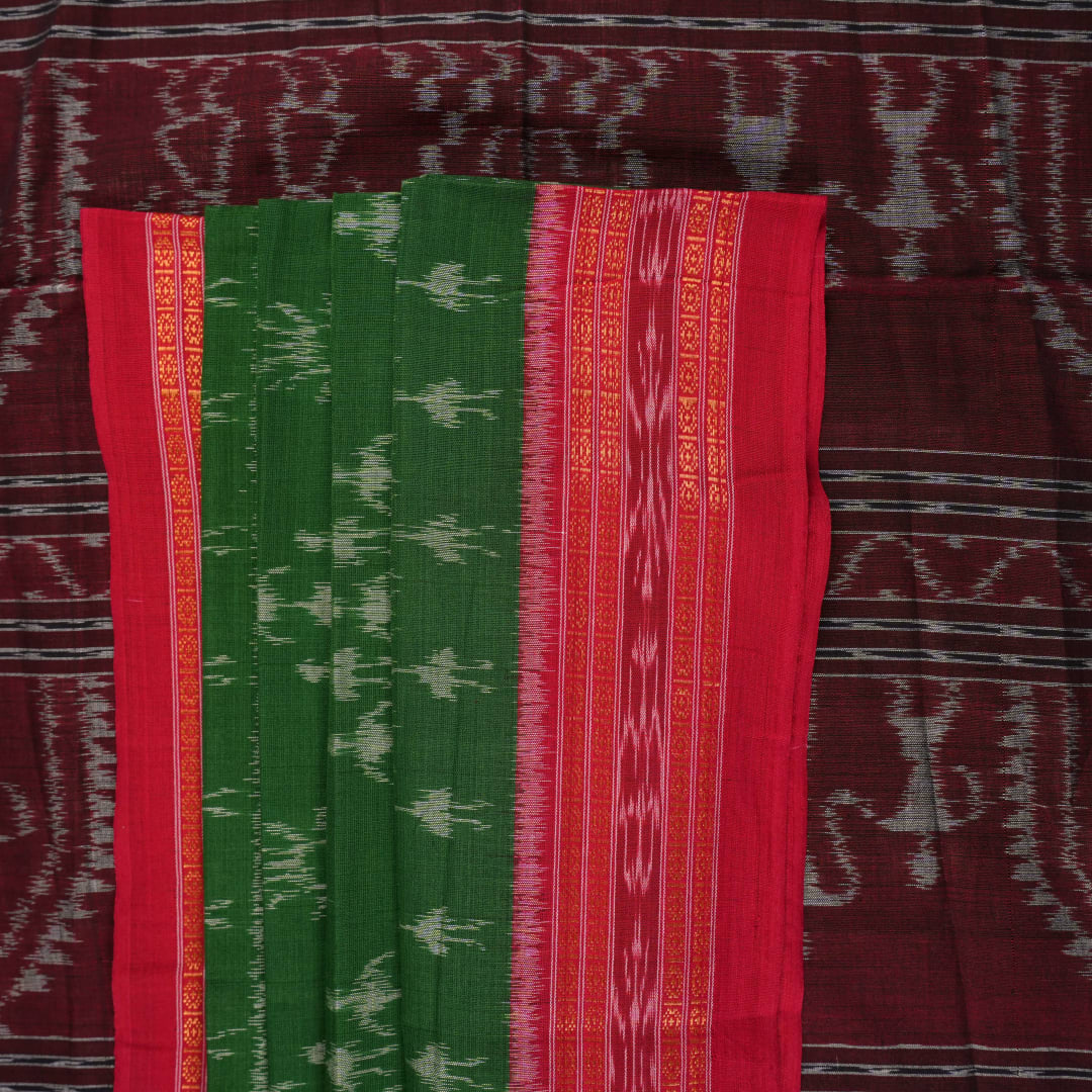 Model draped in a green and red Sambalpuri cotton saree with traditional motifs, styled for a classic look.