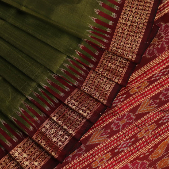 Styling view of vibrant green Khandua silk saree with maroon butta pattern