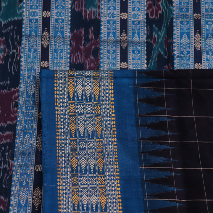 Close-up of handwoven Sambalpuri black silk saree fabric with intricate butta pattern