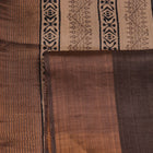 Close-up of printed multi-color handloom Tussar silk saree fabric texture.