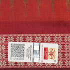 Close-up of Bomkai Silk Saree fabric, highlighting its luxurious brown silk texture and intricate weave.