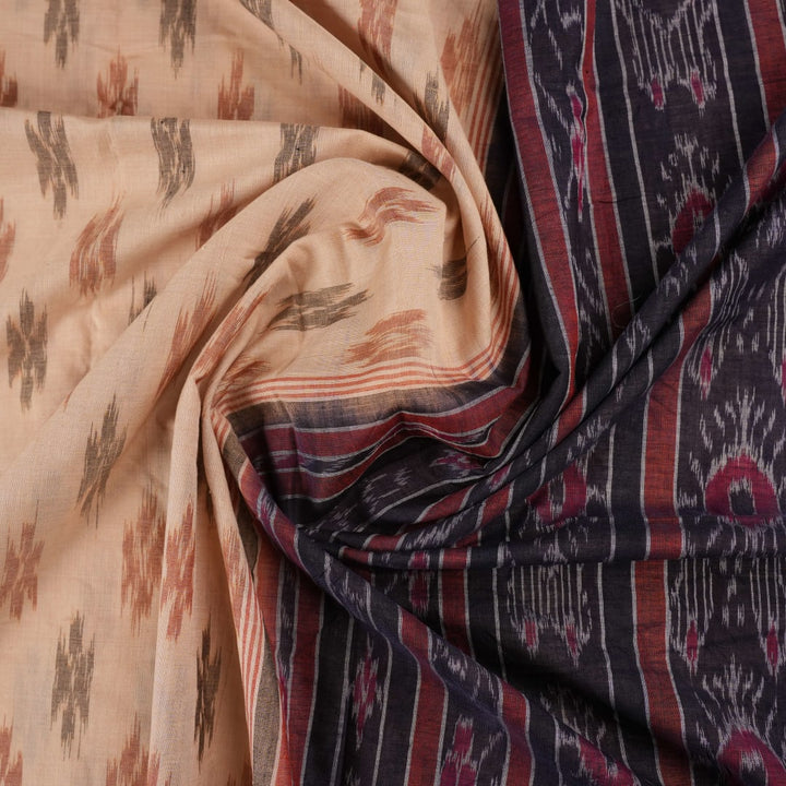 Full styling of a cream and black Sambalpuri cotton saree with traditional motifs on a model.