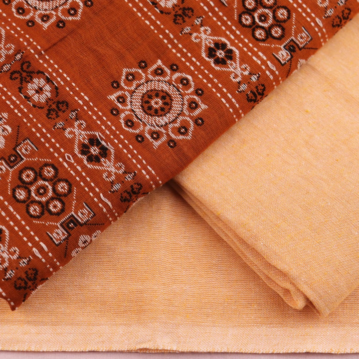 Matching blouse piece detail for the rust and cream Bomkai Cotton Dress Material, showcasing complementary weave.