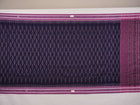 Full styling view of a model draped in a blue and purple Sambalpuri cotton saree with ikat motifs.