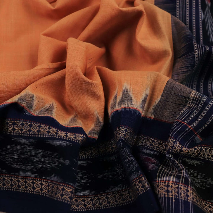 Styling view of a cream and black Sambalpuri cotton dupatta with plain pattern