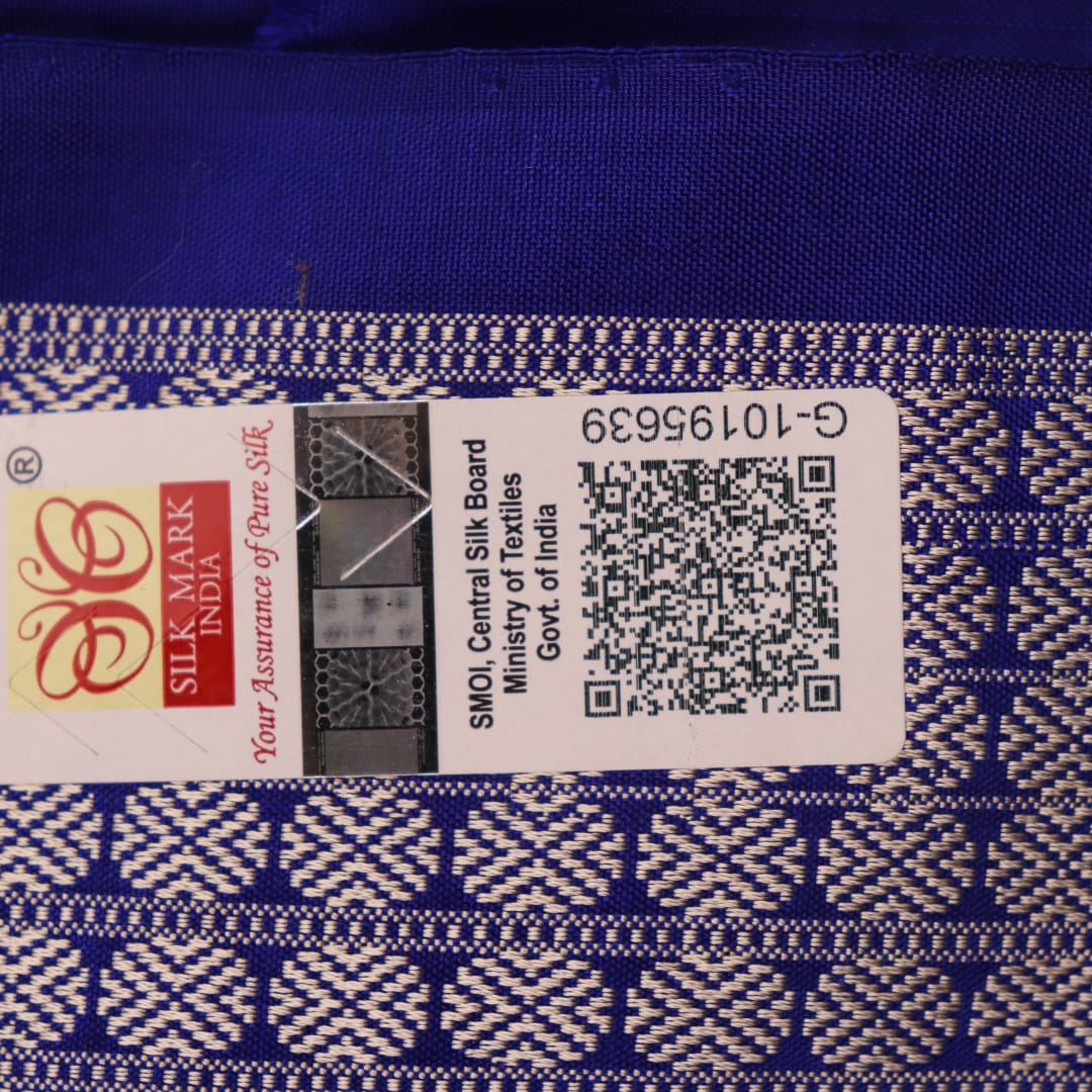 Close-up showcasing the silk texture of a blue and blue Bomkai silk saree with a butta pattern.