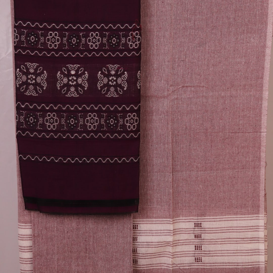 Close-up of Bomkai cotton dress material's matching blouse piece in brown with subtle purple details.