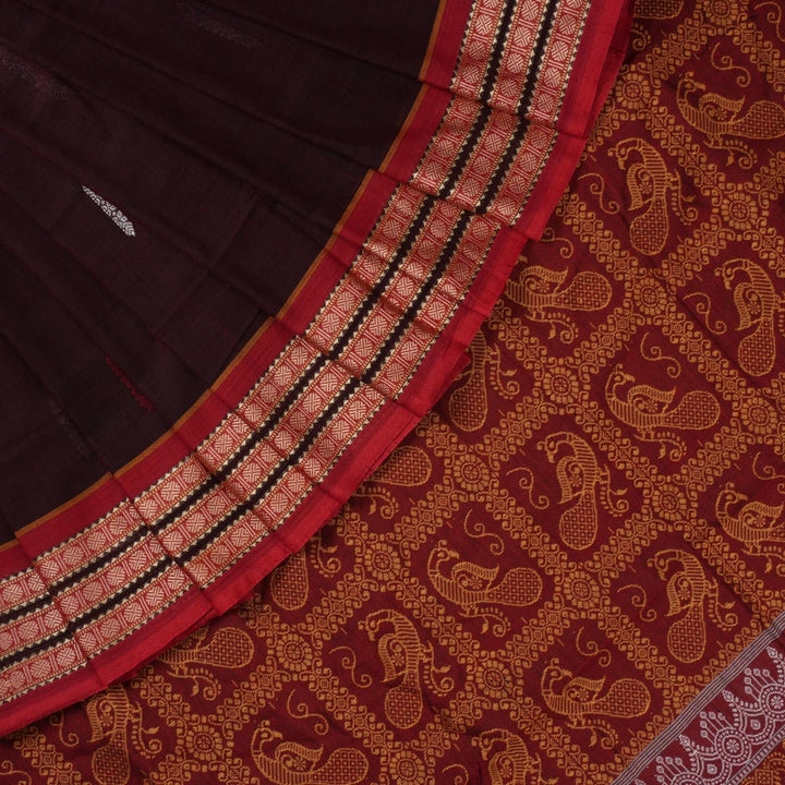 Full view of the maroon Bomkai cotton saree with red borders and small butta motifs laid out flat.