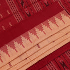 Full view of a cream and maroon Sambalpuri cotton saree with butta pattern.