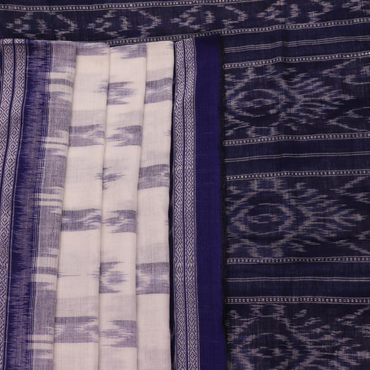 Model wearing a white Sambalpuri cotton saree with blue motifs, showcasing the drape and overall look.