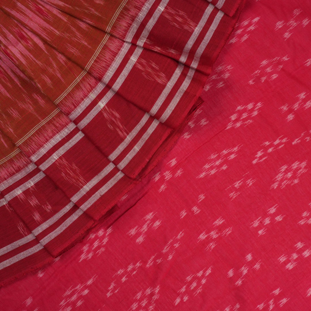 Model styled in a red multi-color Sambalpuri cotton saree featuring traditional hand-woven ikat motifs.