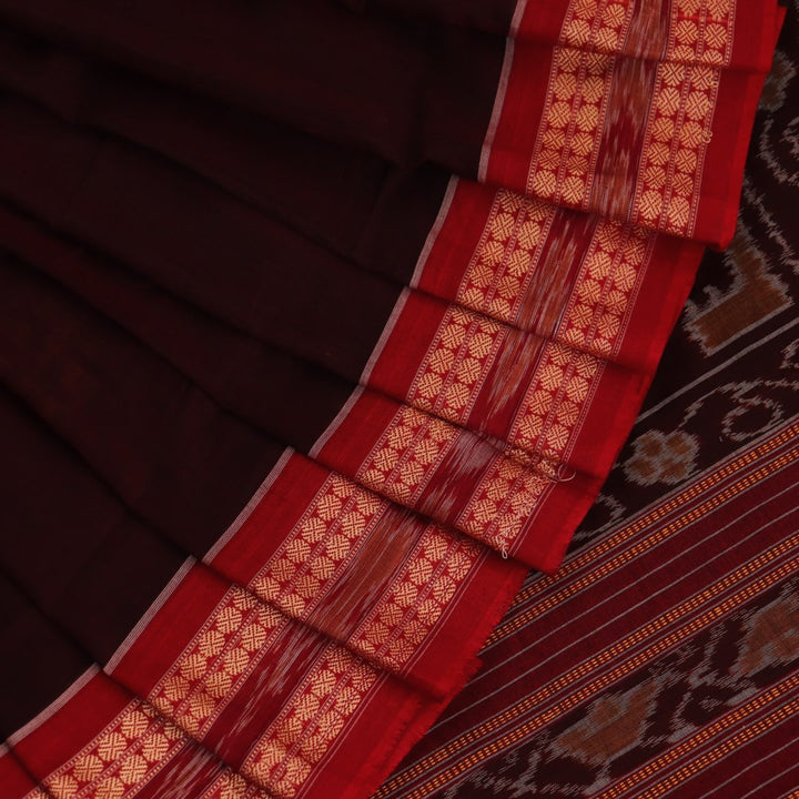 Full view of a maroon cotton Bomkai saree featuring a butta pattern with a red border and pallu.