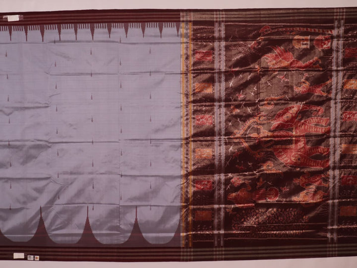 Close-up of grey and maroon Sambalpuri Silk Saree's butta pattern fabric texture.