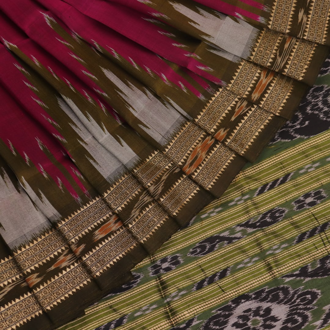 Magenta Khandua silk saree styled; green blouse accentuates the butta pattern and rich drape.